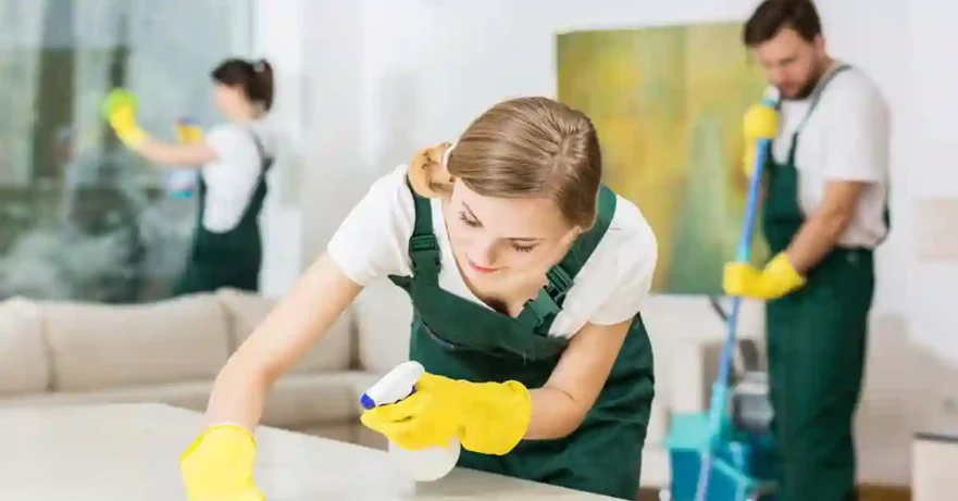 Residential cleaners wiping table top