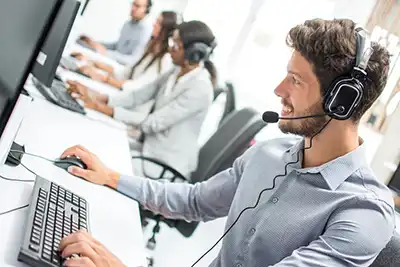 Dispatcher Using Software at Call Center