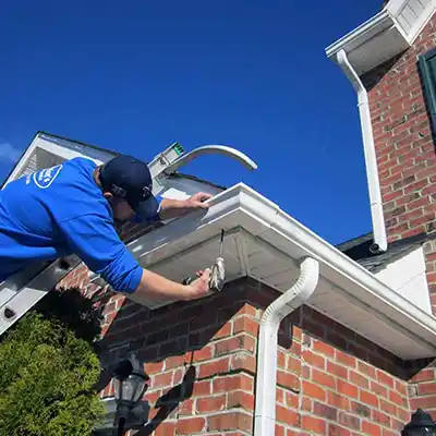 Gutter Software used by Man on Ladder