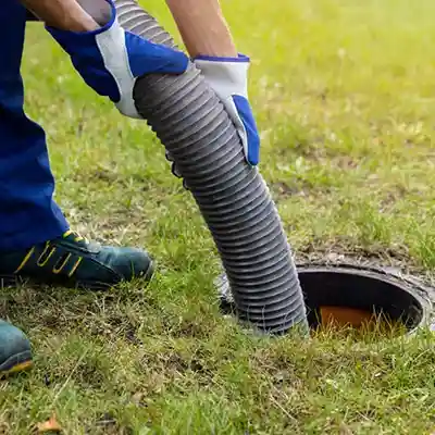 Man pumping tank using Septic Business Software