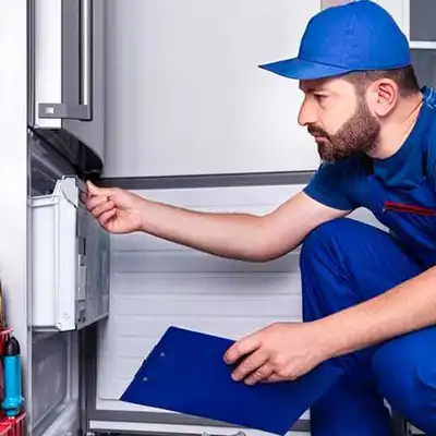 Tech in Blue Uniform using Appliance Repair Software