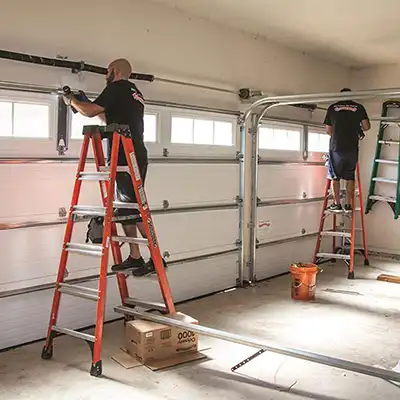 Garage Door Software used by two Men on Ladders