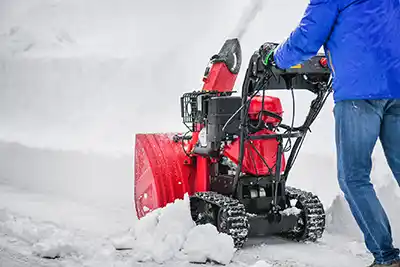 Man Pushing Snow Blower