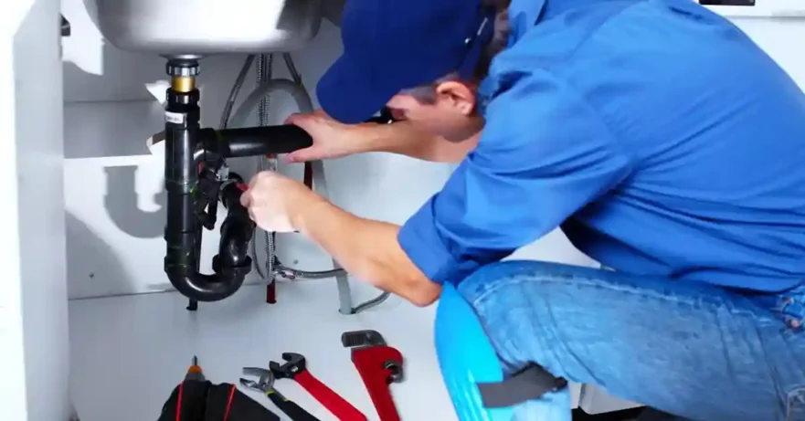 Plumber Tightening Sink Drain